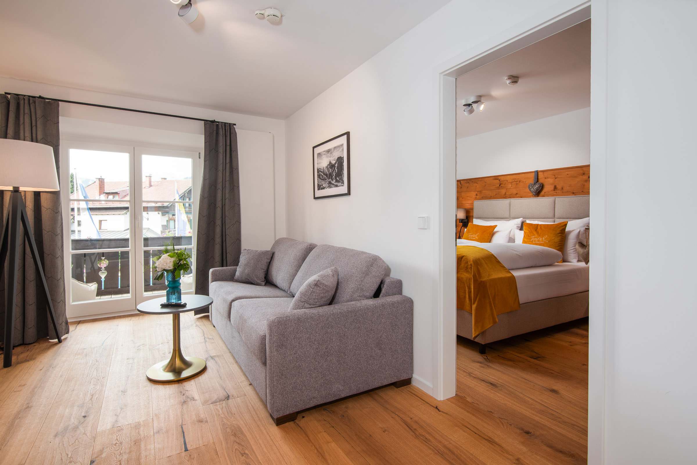 Deluxe room at Hotel Terofal in Schliersee with two rooms and balcony with lake view