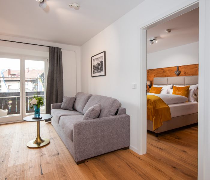 Deluxe room at Hotel Terofal in Schliersee with two rooms and balcony with lake view