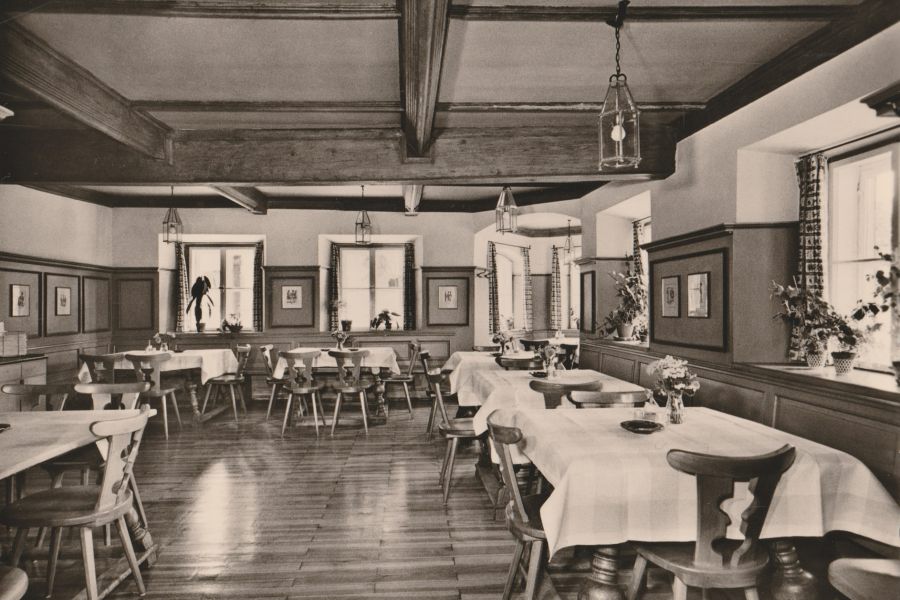 Black and white photo of the historic rustic dining room at Restaurant Xaver in Schliersee
