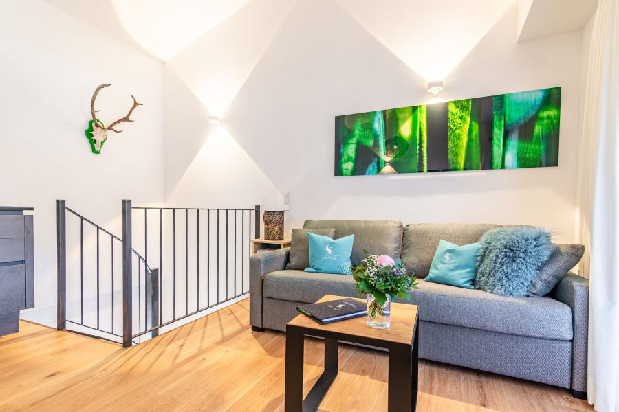 Upper floor with cozy seating area of the “Seppi” holiday apartment at Seeheimat in Schliersee