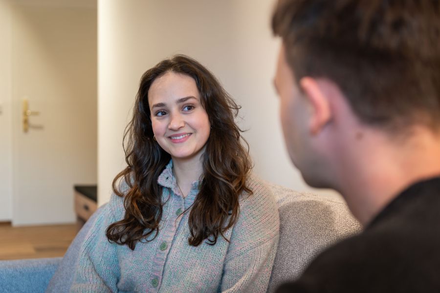 Hotel guests relaxing in the seating area of their room at Hotel Terofal