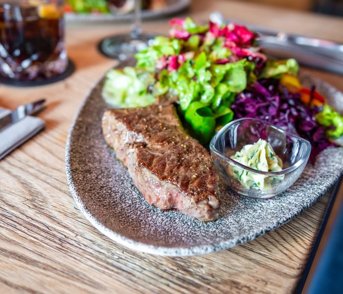Steak with homemade herb butter and fresh side salad at Restaurant Xaver in Schliersee