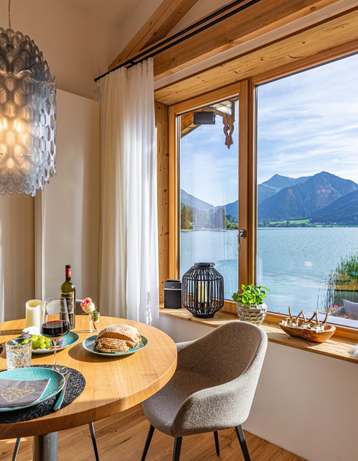 Holiday apartment at Seeheimat in Schliersee, with a view from the living room of the lake and surrounding mountains