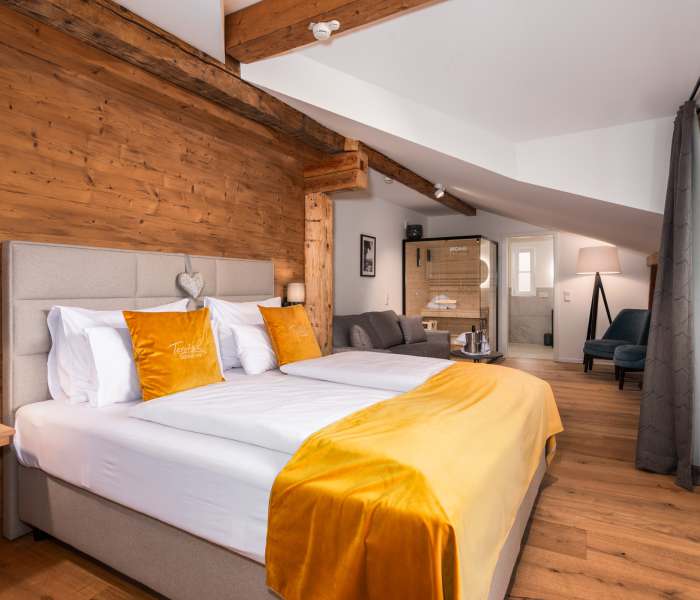 Wellness room at Hotel Terofal in Schliersee with double bed and balcony with lake view