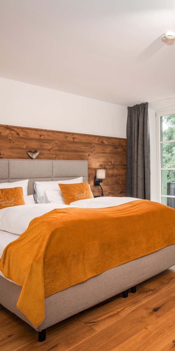 Room at Hotel Terofal in Schliersee with a comfortable box-spring bed